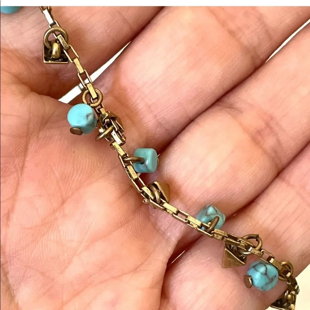 Loft gold tone and turquoise charm bracelet